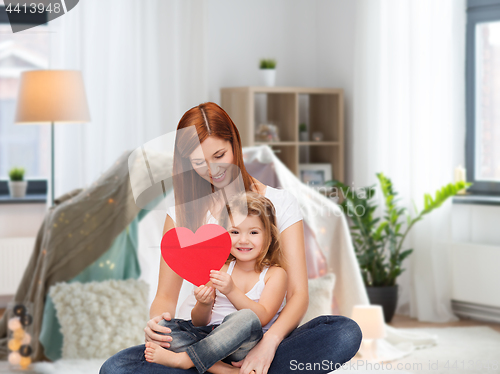 Image of happy mother with adorable little girl and heart