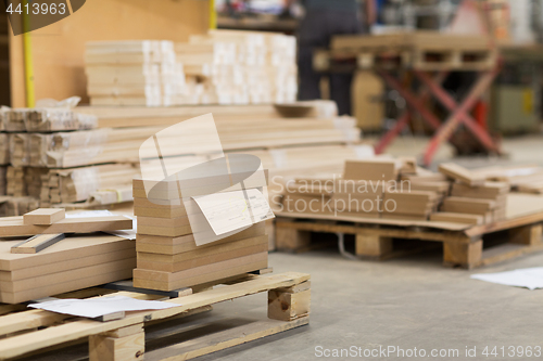 Image of wooden boards at workshop or woodworking plant