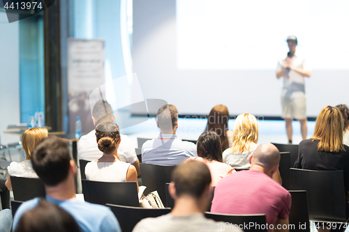 Image of Business speaker giving a talk at business conference event.