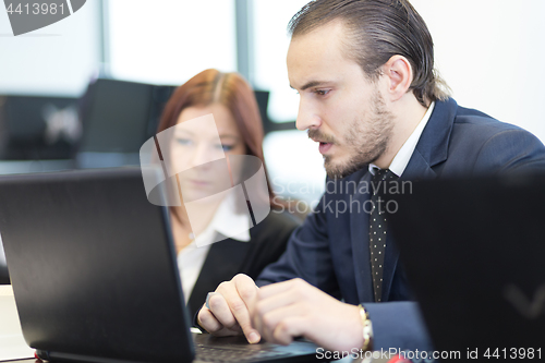 Image of Business people in modern office.