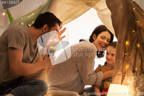 Image of father telling scary stories to his daughter