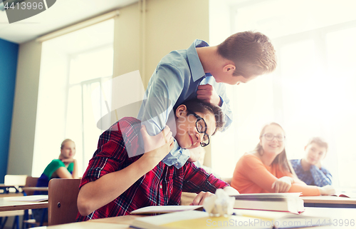 Image of student boy suffering of classmate mockery