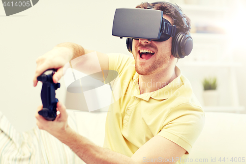 Image of man in virtual reality headset with controller