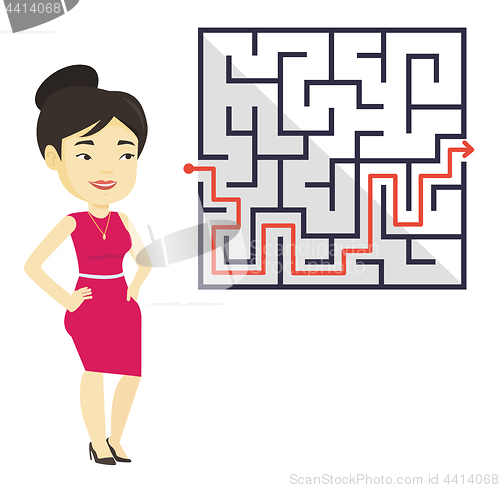 Image of Business woman looking at labyrinth with solution.