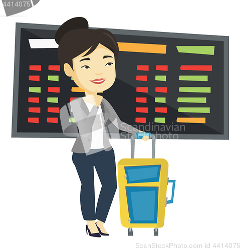 Image of Young woman waiting for flight at the airport.