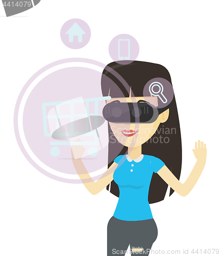 Image of Woman in virtual reality headset shopping online.