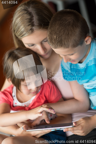 Image of Young Family Using A Tablet To Make Future Plans