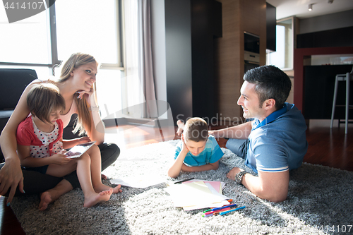 Image of young couple spending time with kids