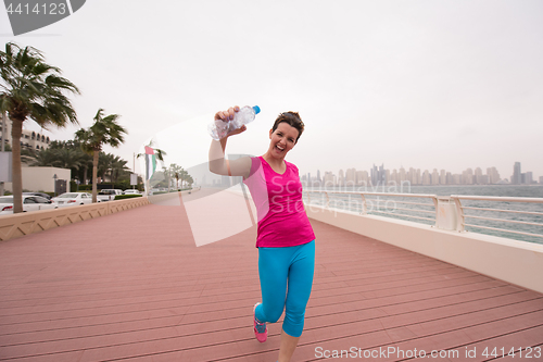 Image of young woman celebrating a successful training run