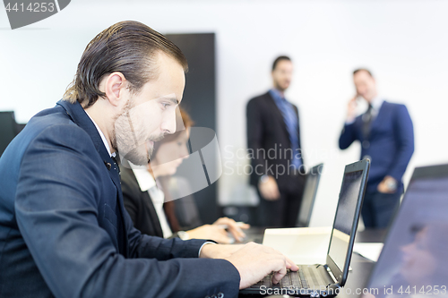 Image of Business people in modern corporate office.