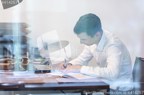 Image of Businessman working with documents in the office