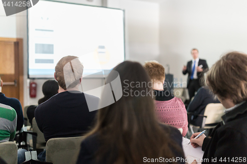 Image of Business speaker giving a talk at business conference event.