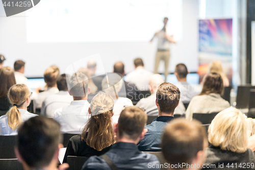 Image of Business speaker giving a talk at business conference event.