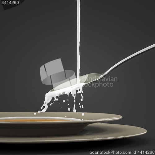 Image of milk splashing at the spoon