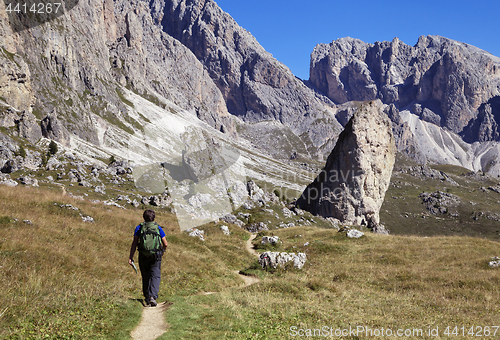 Image of A tourist hiking in Val di Gardena in the Dolomites