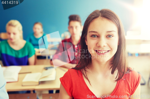 Image of happy student girl at school lesson