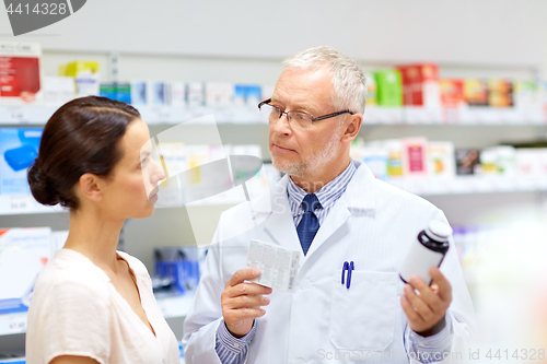 Image of apothecary and woman with drug at pharmacy