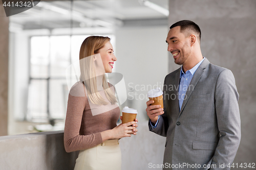 Image of businesswoman and businessman at coffee break