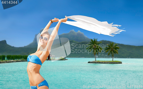 Image of woman in bikini and sunglasses on bora bora beach