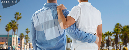 Image of close up of gay couple hugging over los angeles