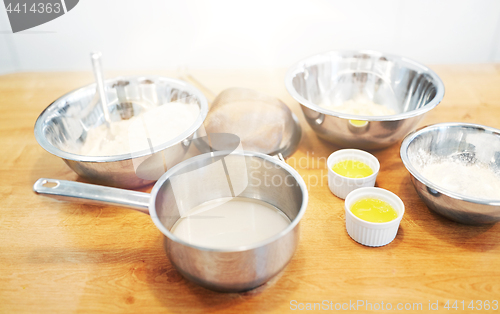 Image of bowls with flour and egg whites at bakery kitchen