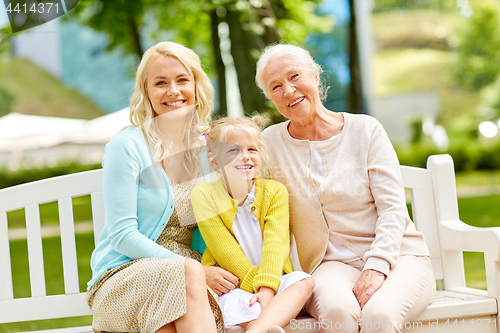 Image of woman with daughter and senior mother at park