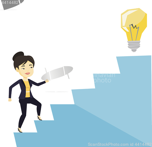 Image of Business woman walking upstairs to the idea bulb.