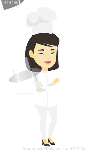 Image of Confident female chief cook with arms crossed.