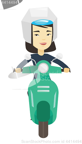 Image of Woman riding scooter in the city.