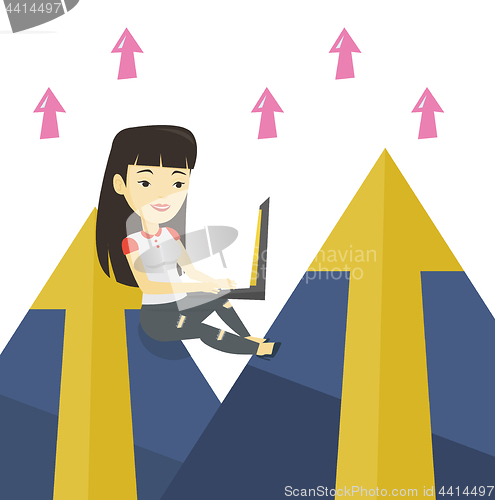 Image of Business woman working on laptop in the mountains.