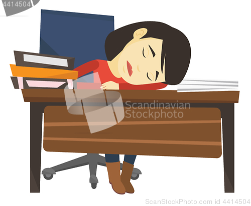 Image of Student sleeping at the desk with book.