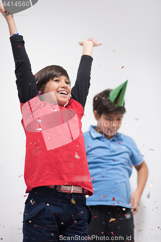 Image of kids  blowing confetti