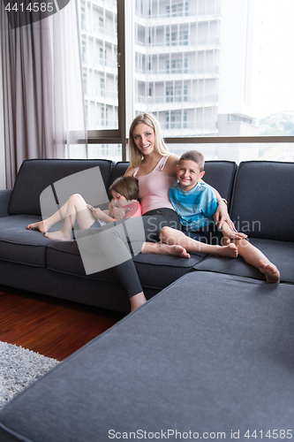 Image of young mother spending time with kids