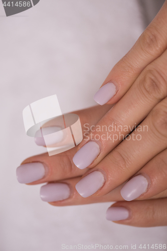 Image of woman fingers with french manicure