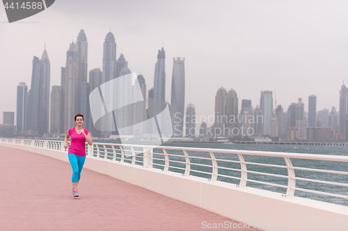 Image of woman running on the promenade