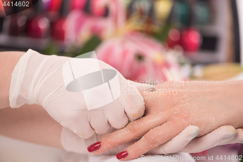Image of Woman hands receiving a manicure