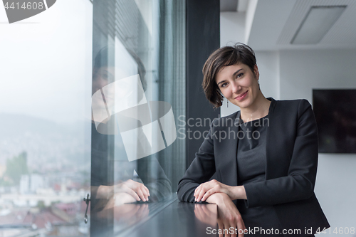 Image of Portrait of successful Businesswoman by the window