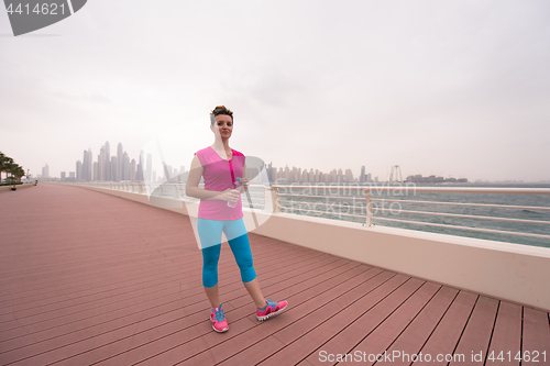 Image of young woman celebrating a successful training run