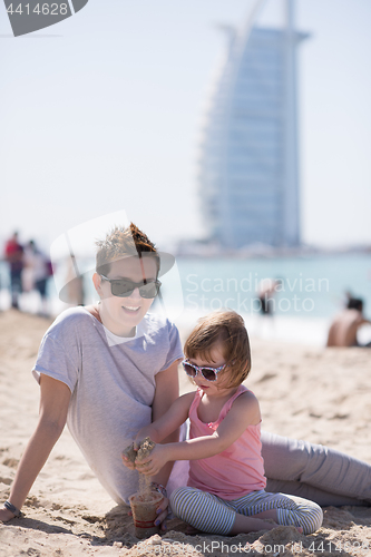 Image of Mom and daughter on the beach