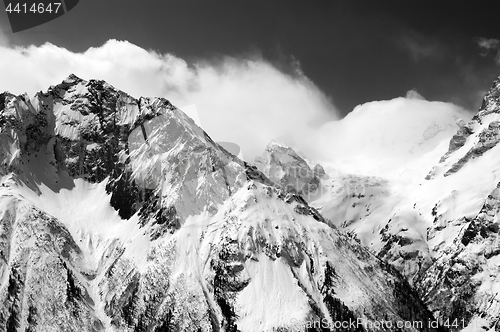 Image of Black and white view of winter snow mountains in cloud