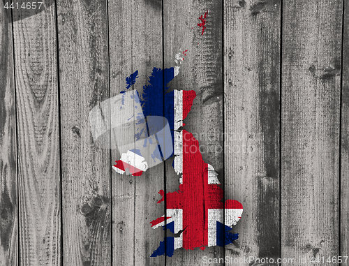 Image of Map and flag of Great Britain on wood,