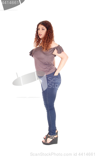 Image of Curvy woman standing in profile 