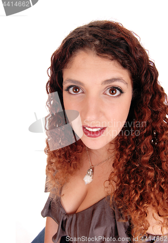 Image of Portrait of beautiful woman with curly brunette hair