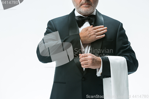 Image of Senior waiter with white towel. Sign language in the restaurant