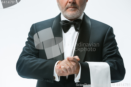 Image of Senior waiter with white towel. Sign language in the restaurant