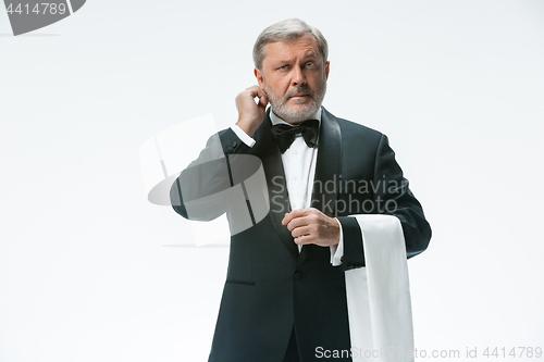 Image of Senior waiter with white towel. Sign language in the restaurant