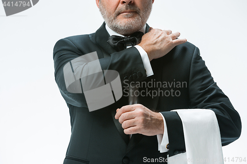 Image of Senior waiter with white towel. Sign language in the restaurant