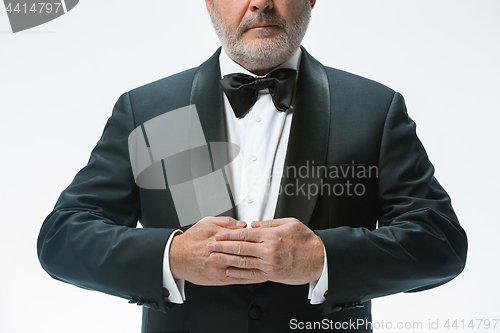 Image of Senior waiter with white towel. Sign language in the restaurant