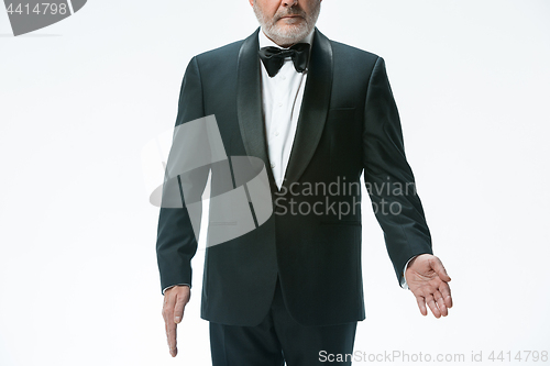 Image of Senior waiter with white towel. Sign language in the restaurant