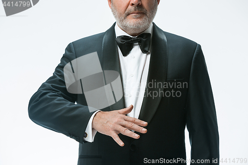 Image of Senior waiter with white towel. Sign language in the restaurant